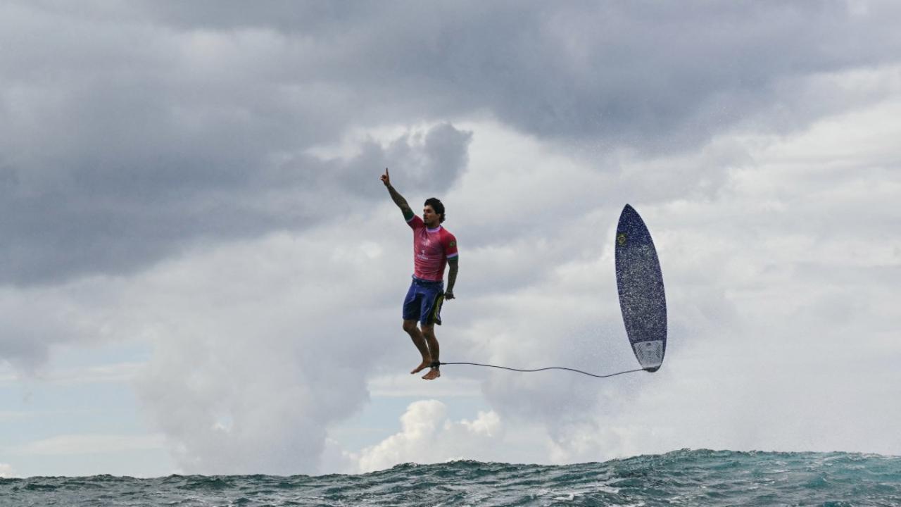 Gabriel Medina
Brazil's surfer Gabriel Medina gave the fans one of the most iconic pictures. During the competition, Medina emerged from the wave, pointing a finger in the air to celebrate his score of 9.9