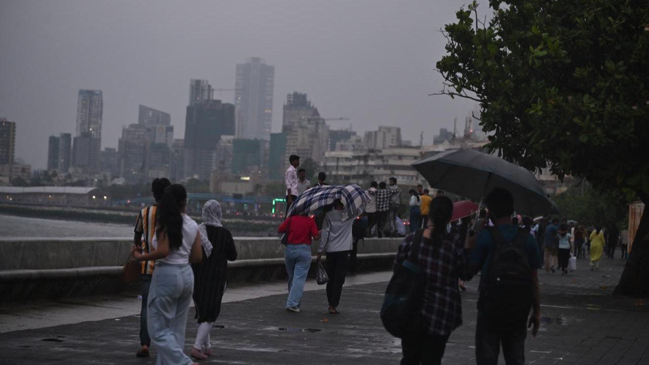 On Friday evening, visitors at Marine Drive were caught off guard by sudden showers that lashed the city after a brief lull.