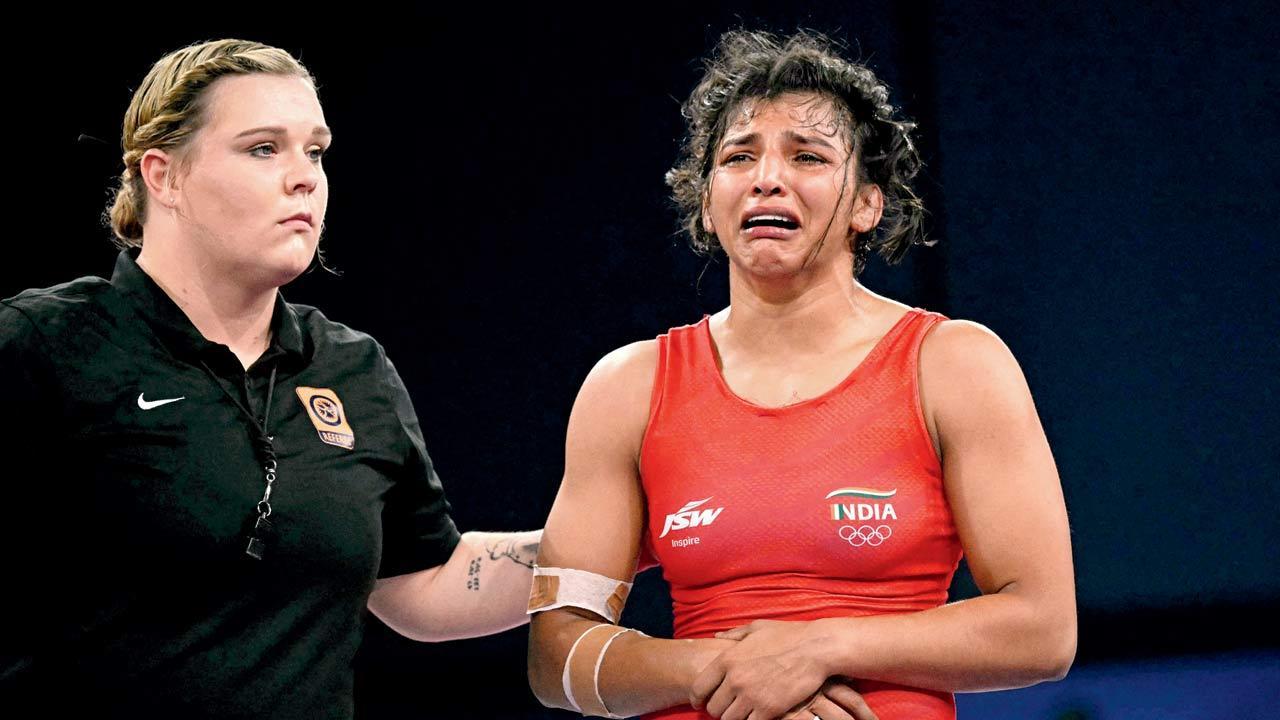 Injured wrestler Nisha loses QF bout