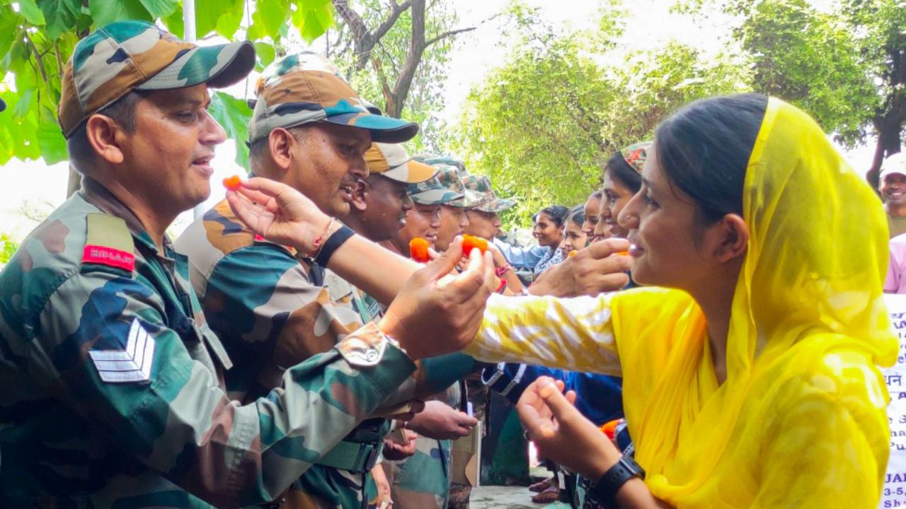 Army soldiers celebrate Raksha Bandhan festival at Akhnoor sector, Jammu on Monday (Pic: ANI)