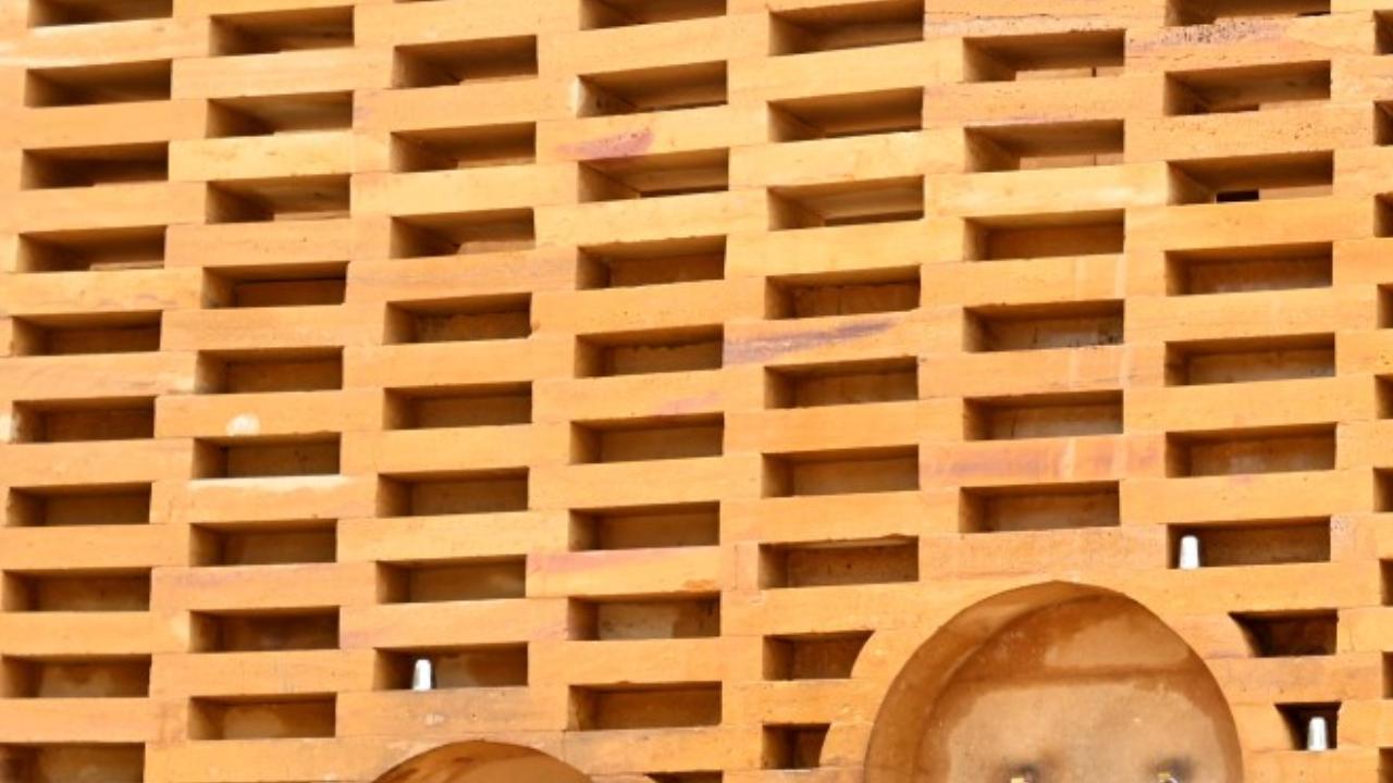 Rainwater is harvested from the flat roof. In some places, the walls are dotted with perforations -- a technique known as 