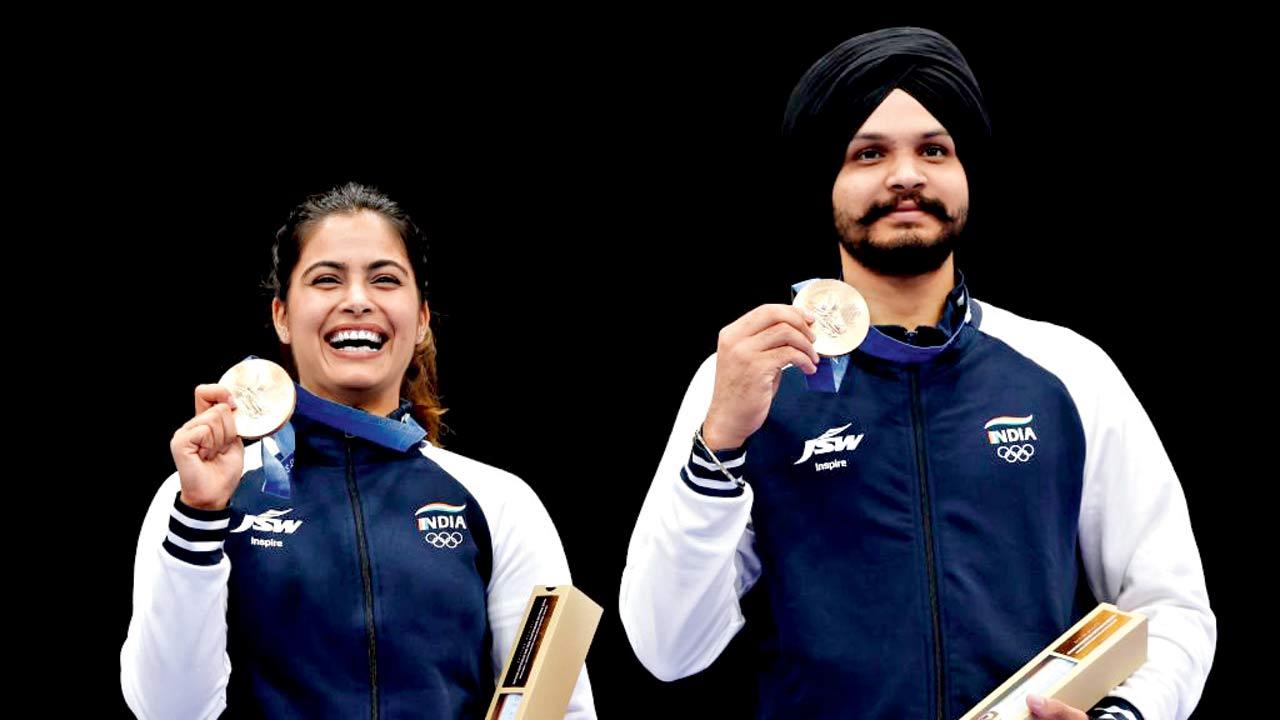 Bronze medalists Manu Bhaker and Sarabjot Singh pose during the Shooting 10m Air Pistol Mixed Team medal ceremony at the Olympic Games Paris 2024. Pic/Getty Images