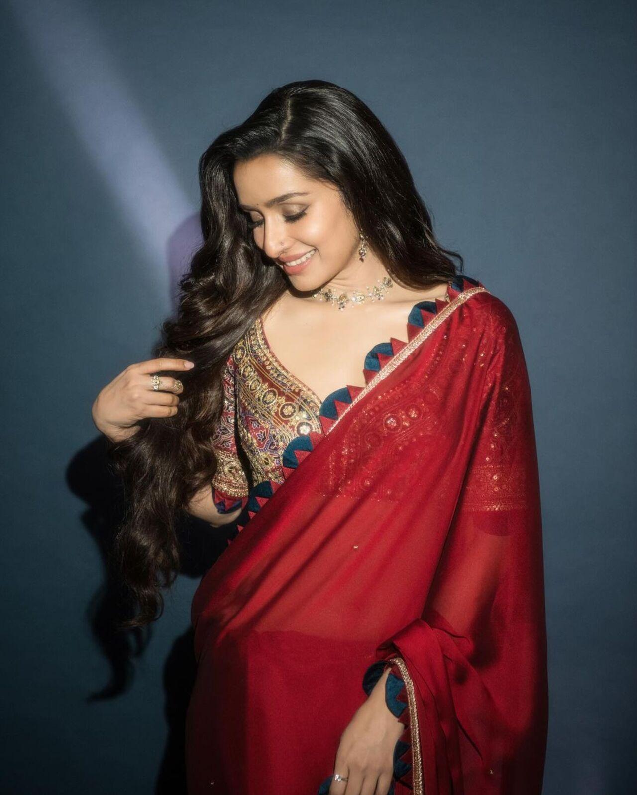 The heavily embroidered multi-coloured contrasting blouse only elevated the look of the satin saree