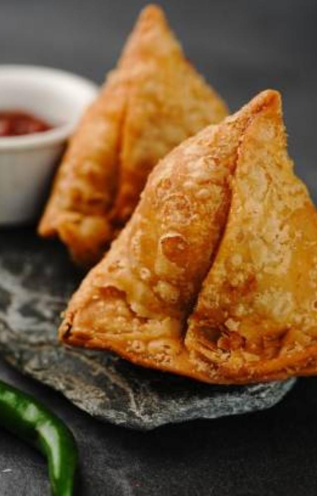 Humidity is the best environment for harmful bacteria to thrive. Try to opt for homemade versions of street food like samosas. 