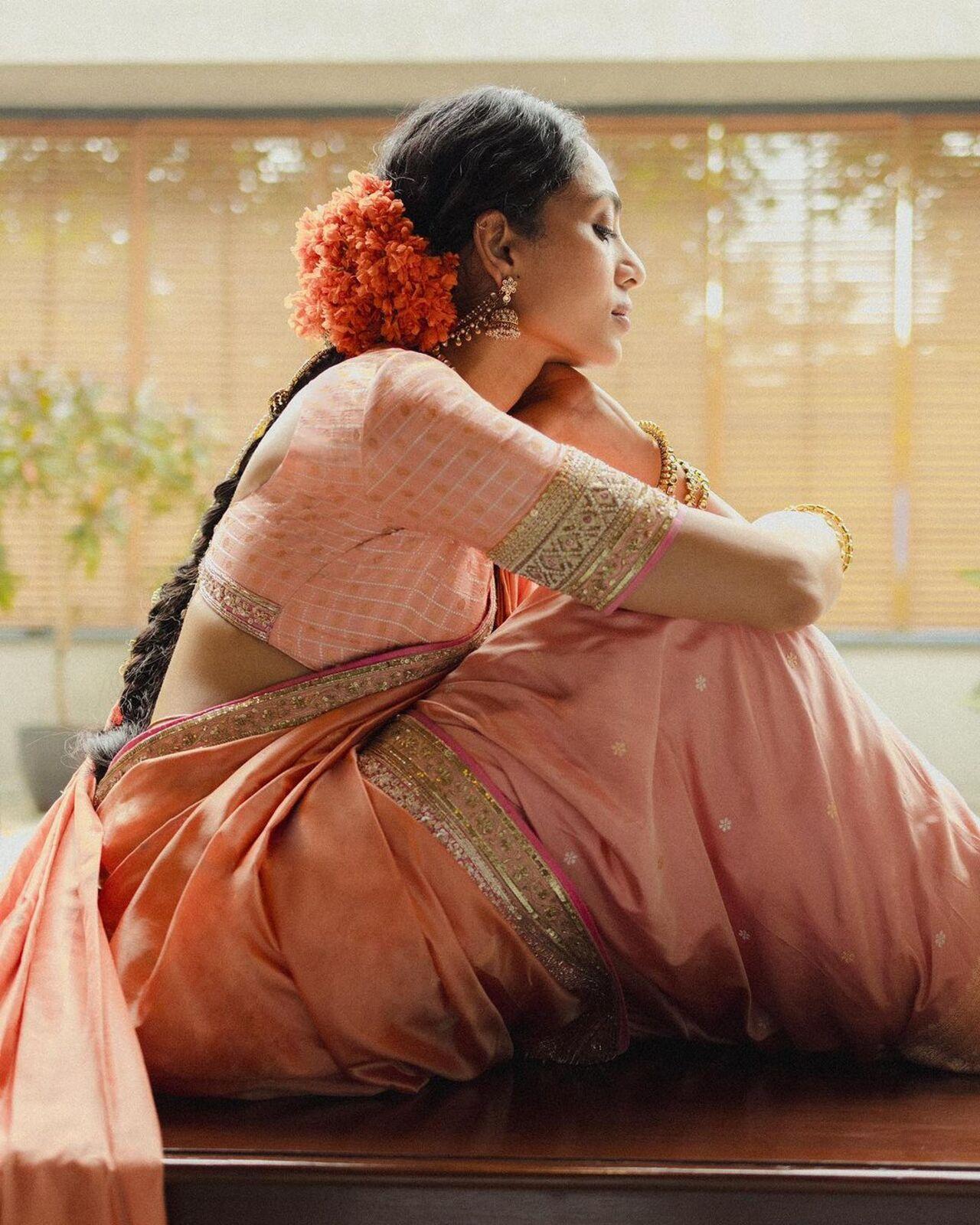 She opted for a hue inspired by the Kanakaambaram, a traditional temple flower worn by Telugu women, and the eternal Padmam (lotus). 