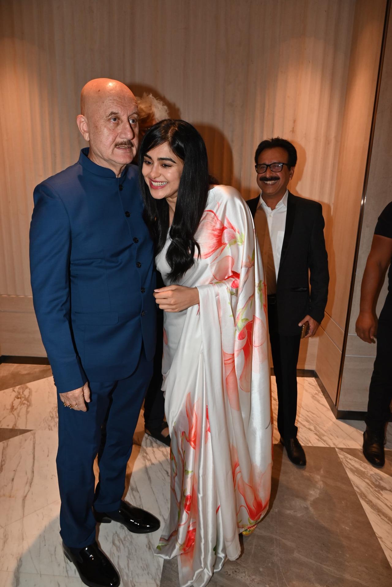 Adah Sharma greets Anupam Kher at an event in the city