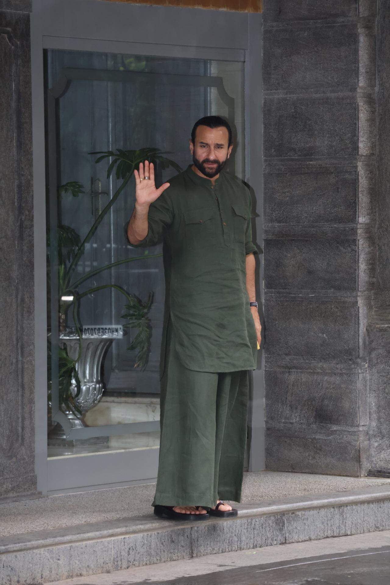 Saif Ali Khan waves to the paps dressed in a green outfit outside Randhir Kapoor's house