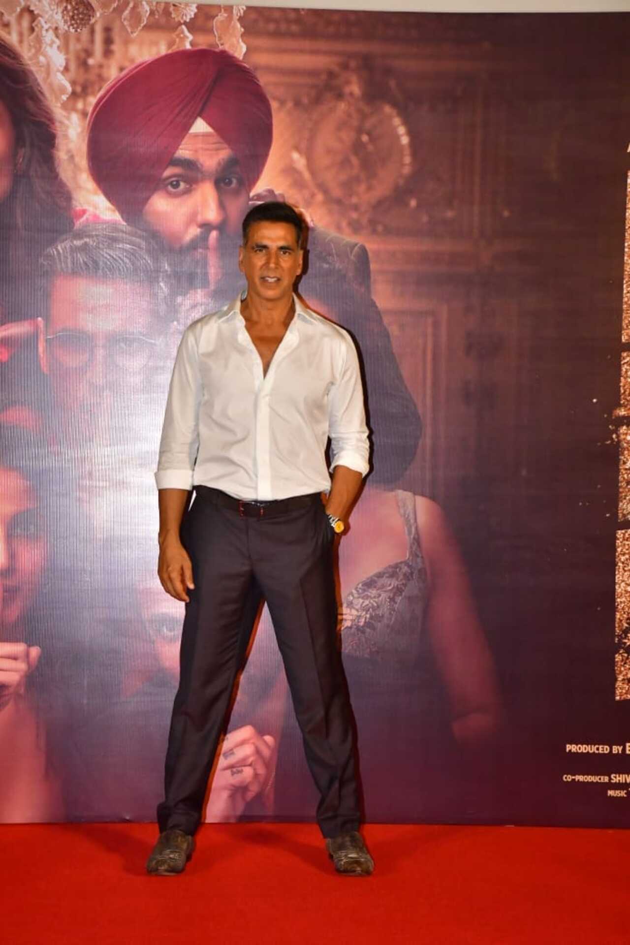 Akshay Kumar strikes a pose in white shirt and black pants at the trailer launch of his next film