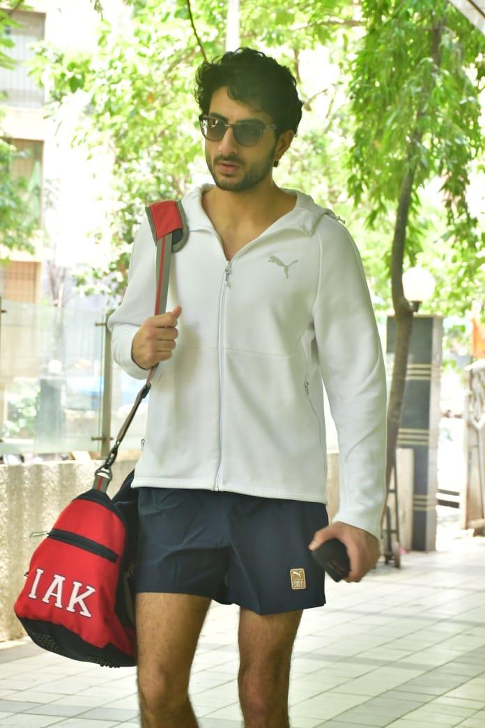 The young star posed for the paparazzi before heading off to his next destination
