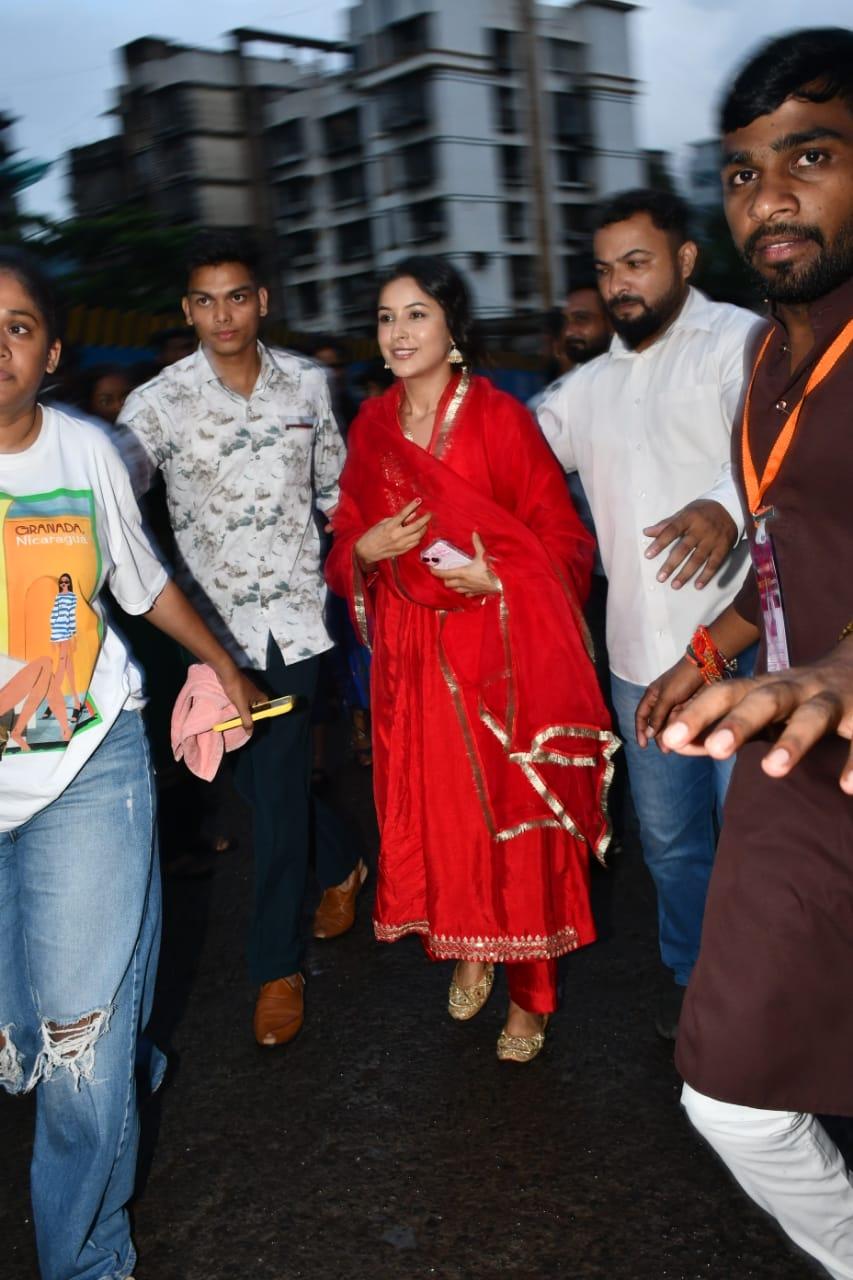 Shehnaaz Gill looked stunning in a red suit as she celebrated Dahi Handi with joy and energy. 