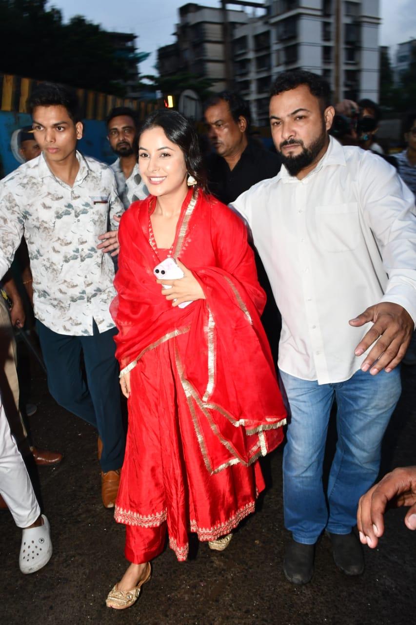 Her vibrant outfit perfectly matched the festive spirit of the occasion.