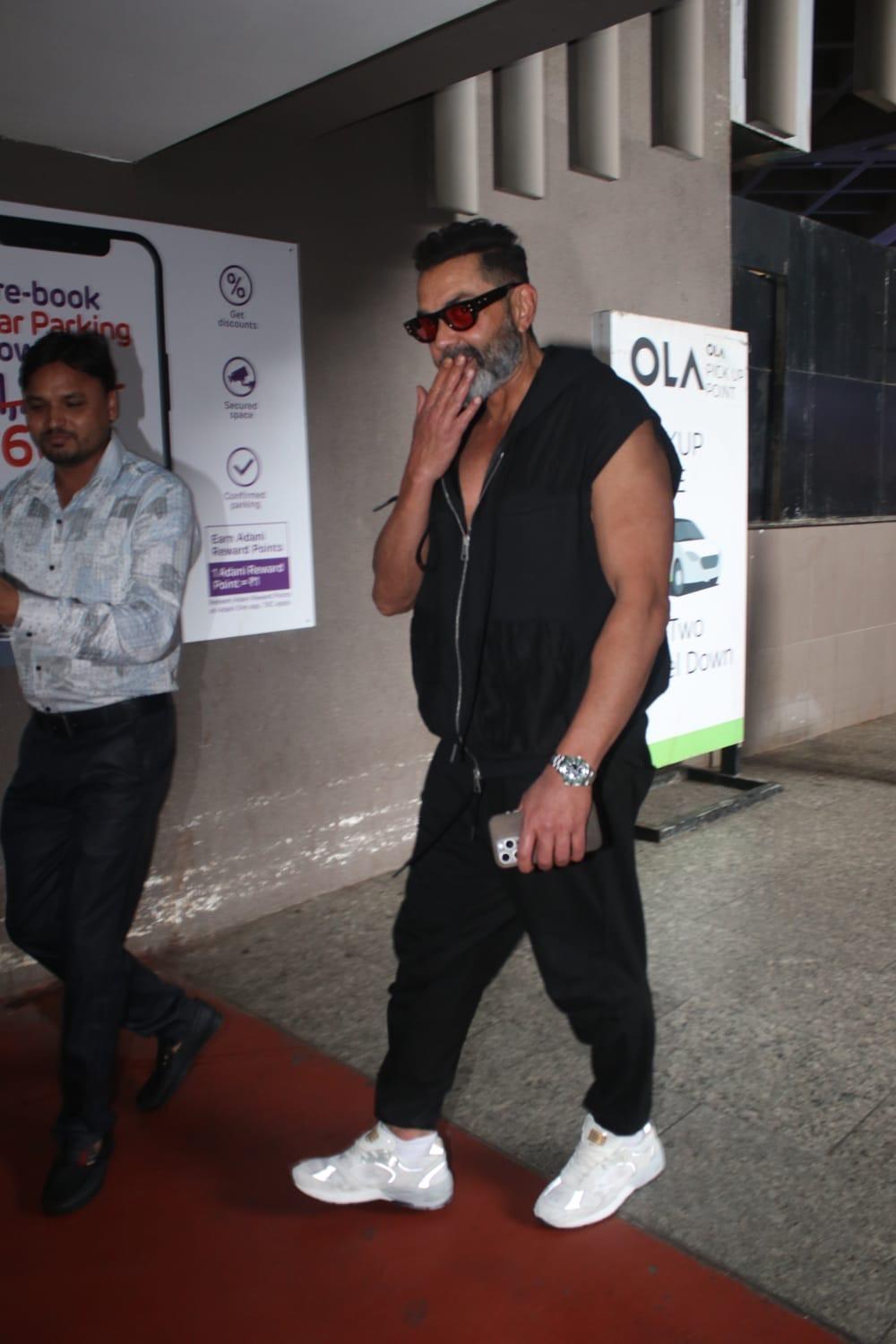 Bobby Deol looked uber cool as he posed for the paparazzi at the Mumbai airport