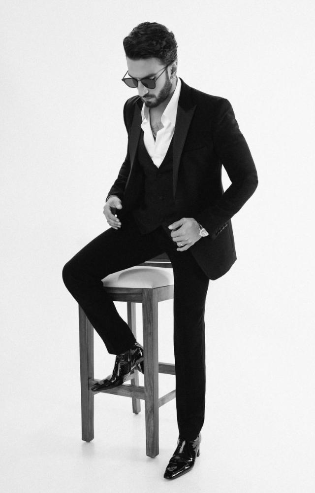 Ranveer Singh, known for his bold fashion choices, recently dazzled in a classic black suit and white shirt
