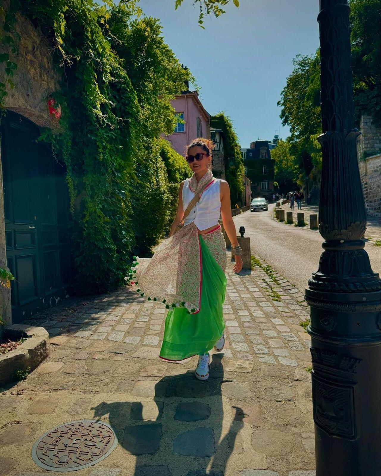 On Day 1, Taapsee wore a lime green saree, a white top, a scarf, and sneakers.
