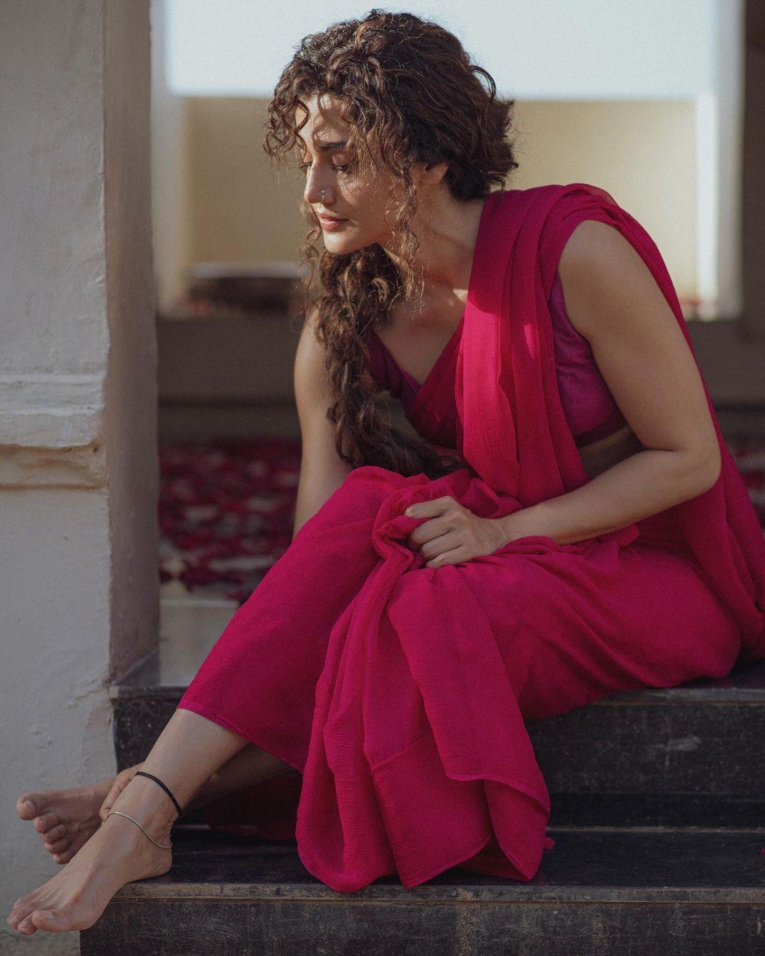 This pink saree paired with a purple blouse in closest to the look of Taapsee's character as Rani Kashyap, which she is reprising in Phir Aayi Hasseen Dillruba.