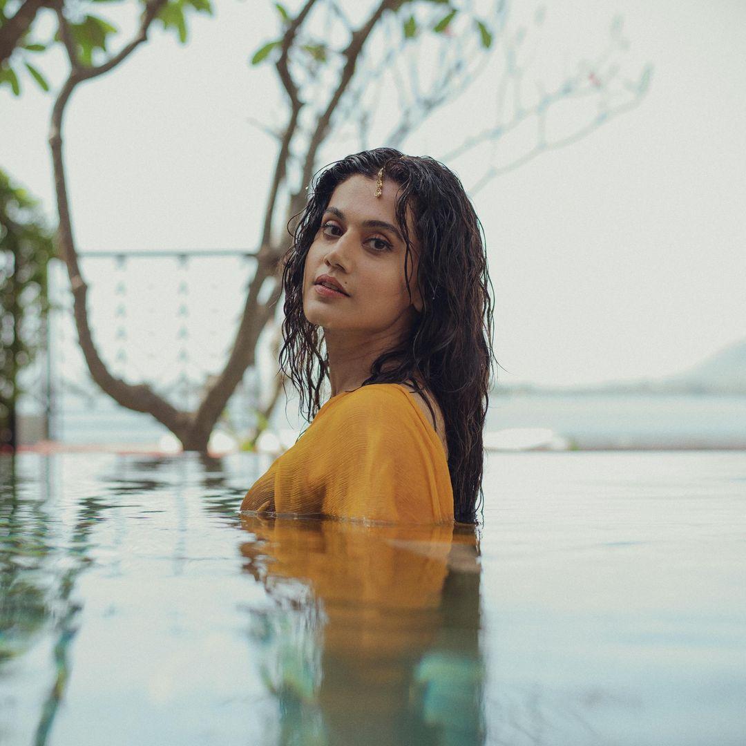 In this wet yellow saree look, Taapsee Pannu embodies the quintessential Bollywood heroine who is the dream girl of millions