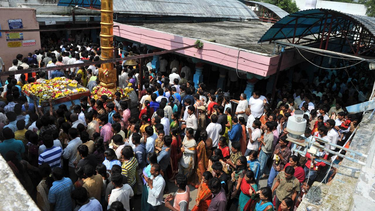 The temple is dedicated to Lord Balaji, who is considered to be an incarnation of Lord Vishnu. Those seeking a shot at the American Dream are instructed to pray for their permission to travel abroad, and to return to give thanks when they receive it. (File Pic/AFP)