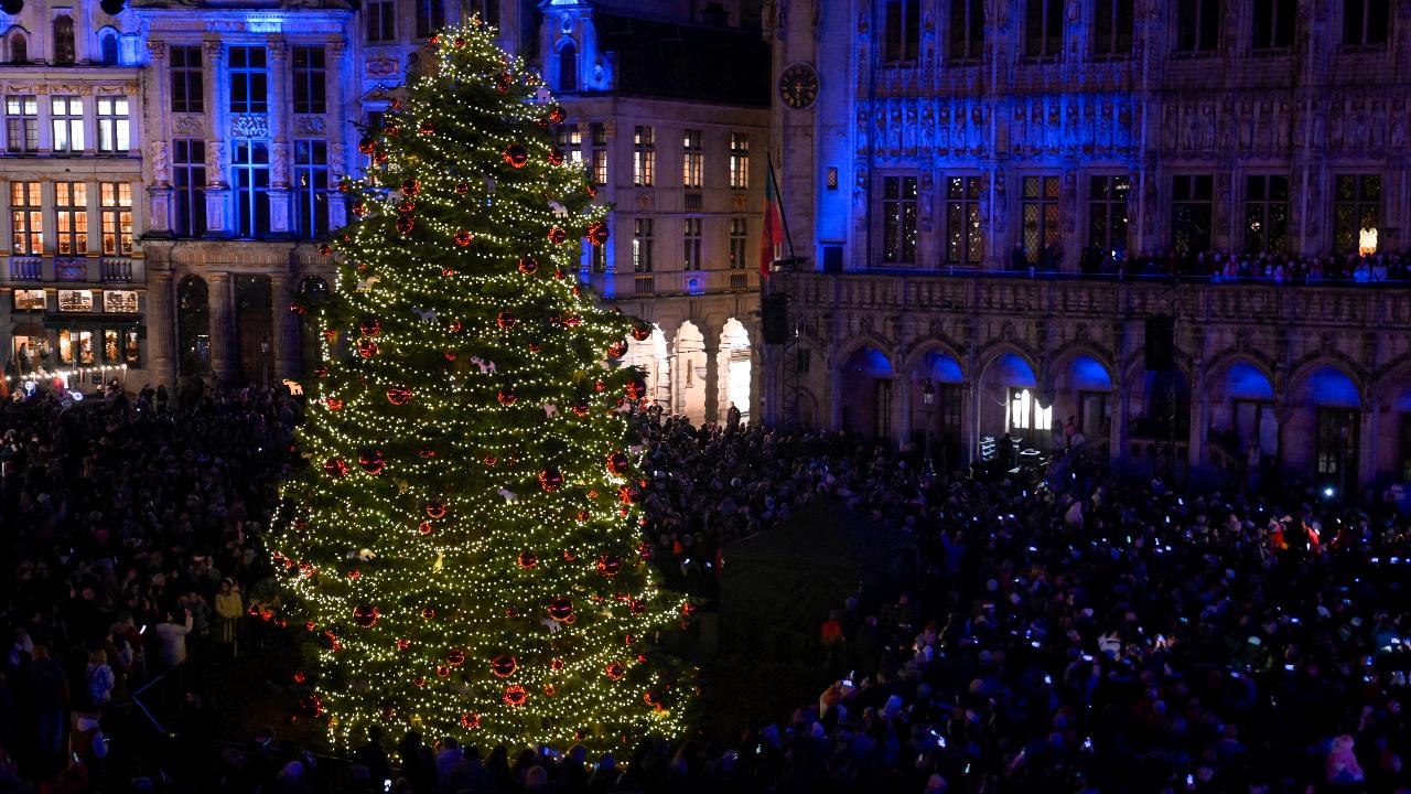 The Christmas tree is illuminated during a light show at the Grand-Place in Brussels to mark the start of the winter and Christmas period