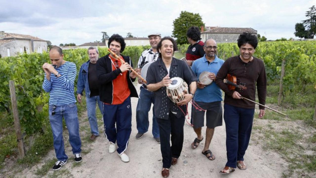 Zakir Hussain (C) poses in vineyards with his band on July 19, 2012 in Saint-Émilion, western France