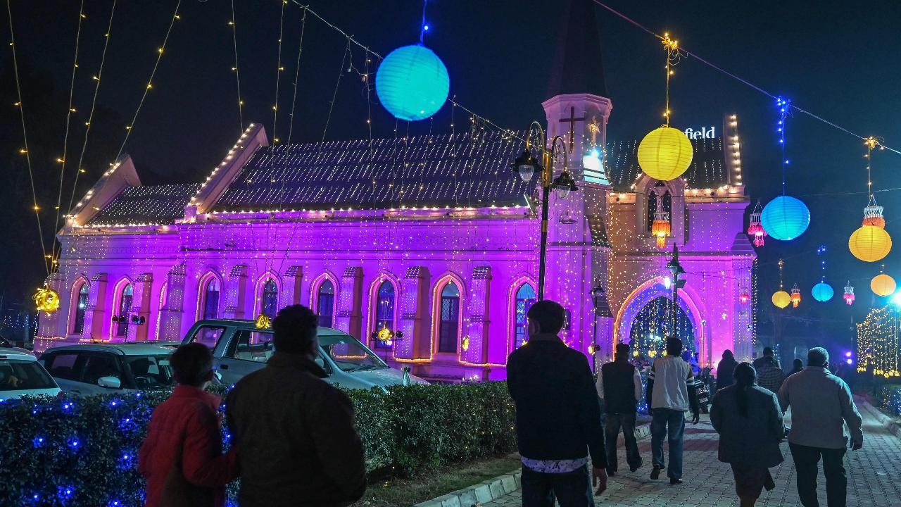 People visit the illuminated St. Paul's Church ahead of the Christmas celebrations in Amritsar (Pic: AFP)