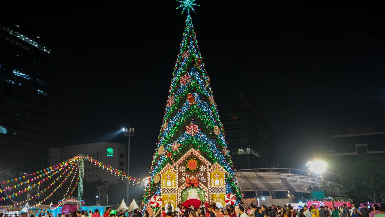 People visit the Jio Wonderland, being held as part of Christmas celebrations at Jio World Garden in Mumbai (Pic: PTI)
