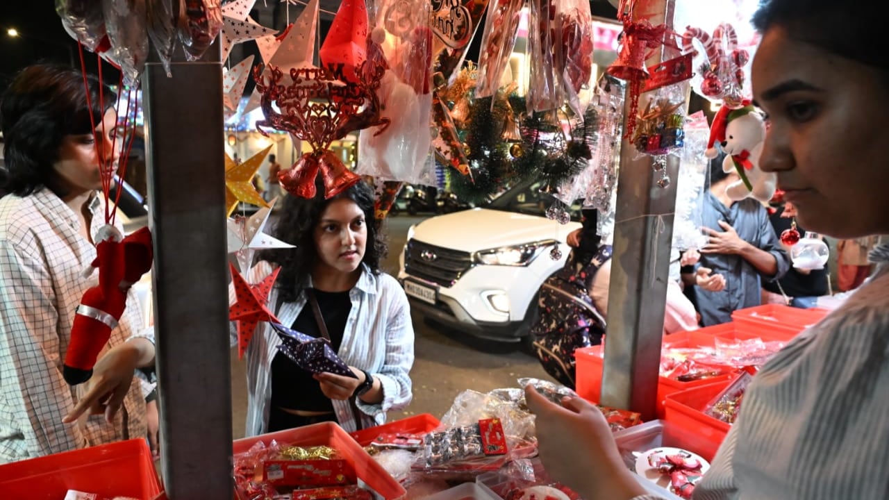 In Pic: Shoppers carefully pick out ornaments like stars, wreaths, etc., for the festive season