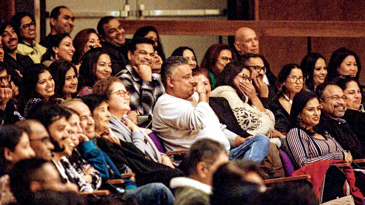 Audience members laugh along during a previous performance 