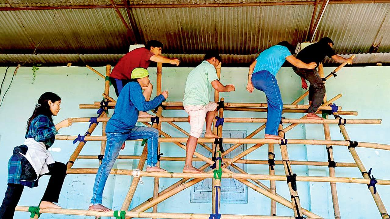 The crew readies the bamboo structure for the performance of Raghunath