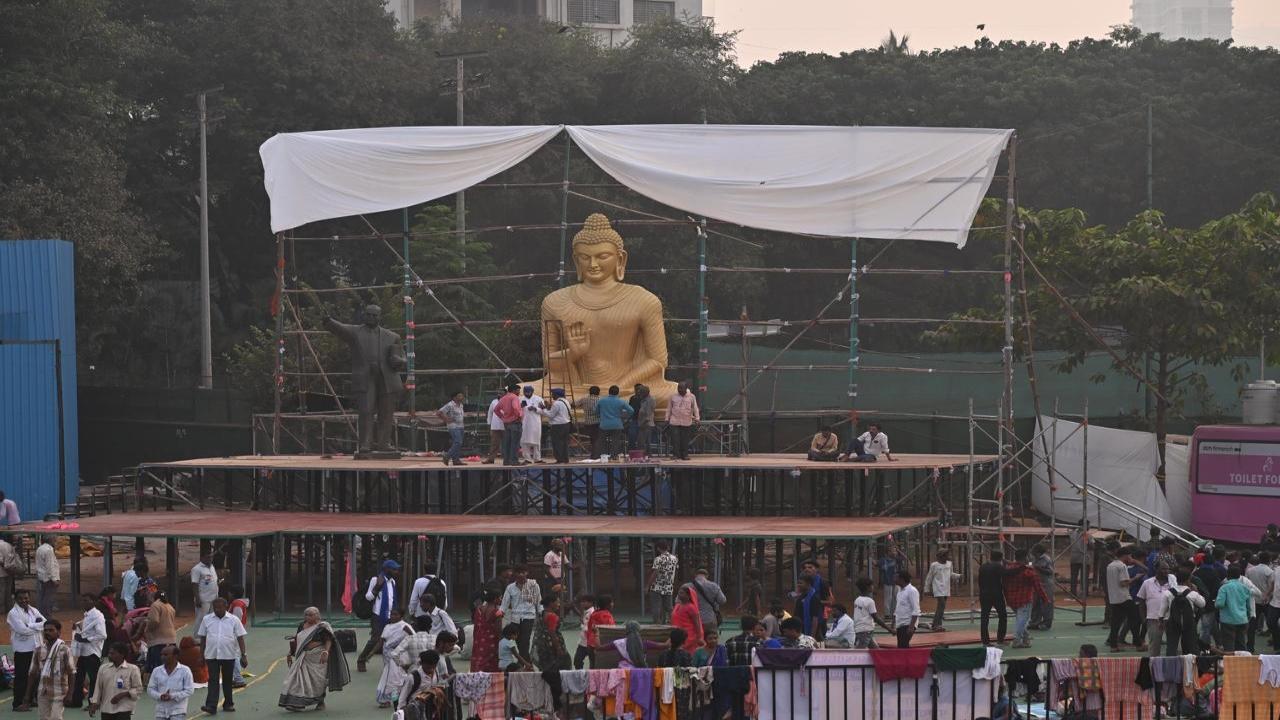 Workers ready a stage with Lord Buddha and Dr Ambedkar's statues at Chaityabhoomi 