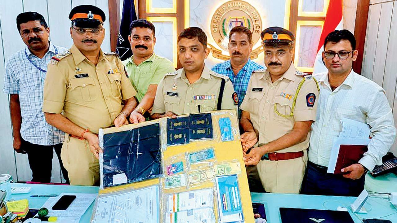 Cash and fake documents, including passports, that were seized from the accused. File Pics