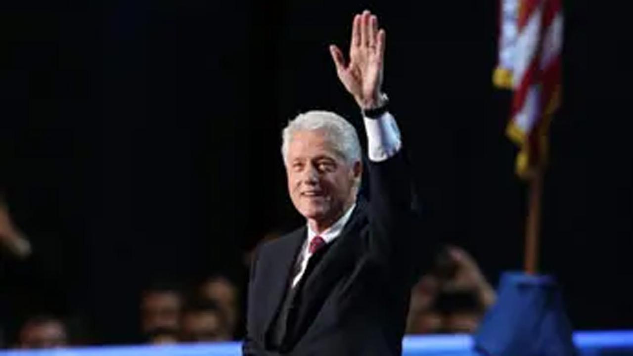 Bill Clinton is hospitalized with fever but in good spirits, says spokesperson