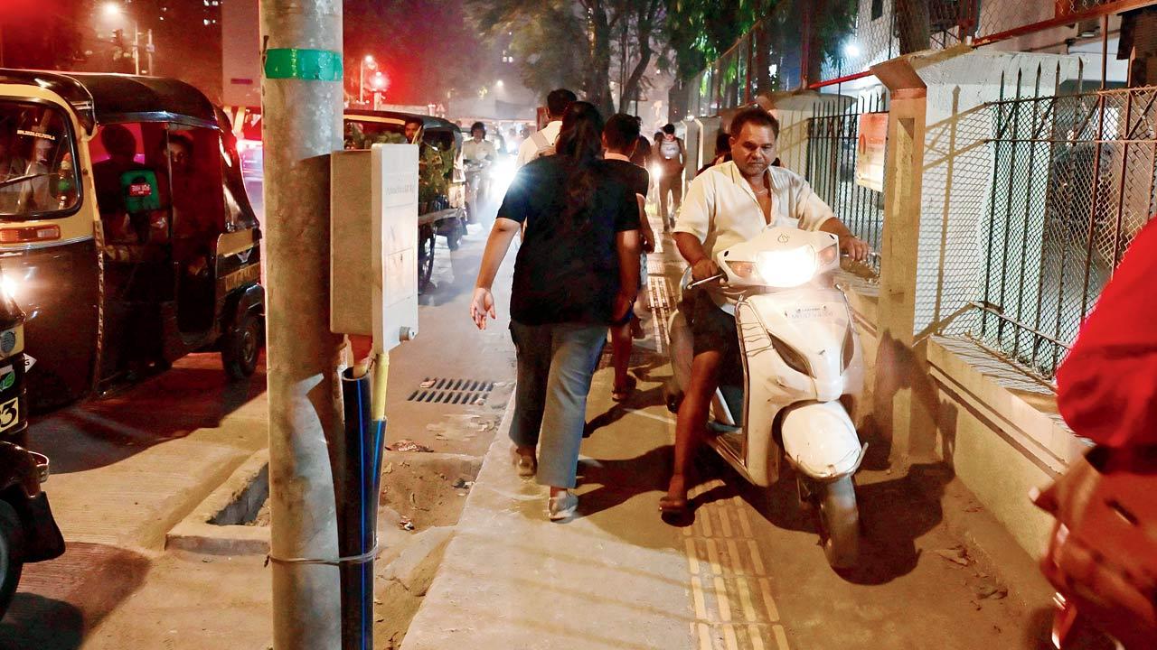A biker is forced to use the footpath at Kanti Park Road