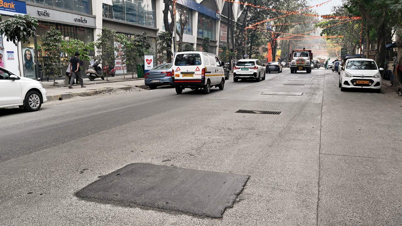 Andheri: Uneven tar patches on stormwater drains make the rides bumpy