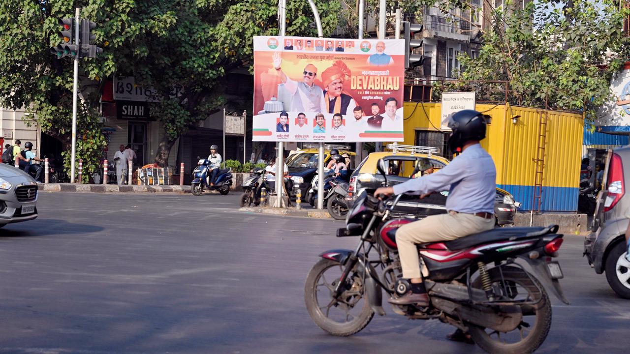 A poster near the Royal Opera House intersection, causing visibility issues. Pic/Atul Kamble