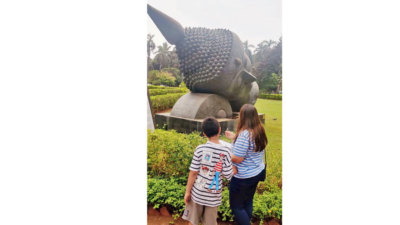A mother-child duo observe an installation at CSMVS