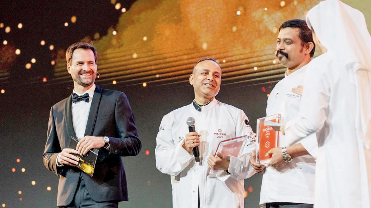 Chef Surender Mohan (centre) accepts the Michelin honour in Doha