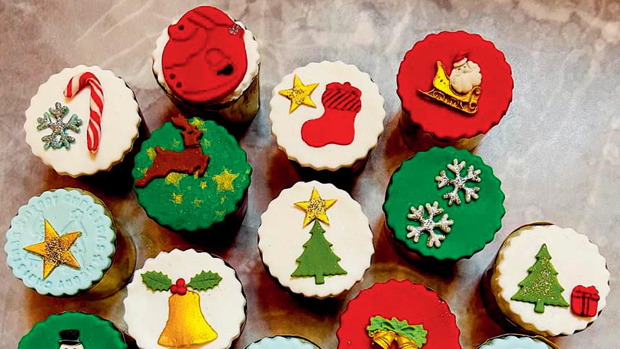 Christmas-patterned mini fruit cakes topped with marzipan and fondant
