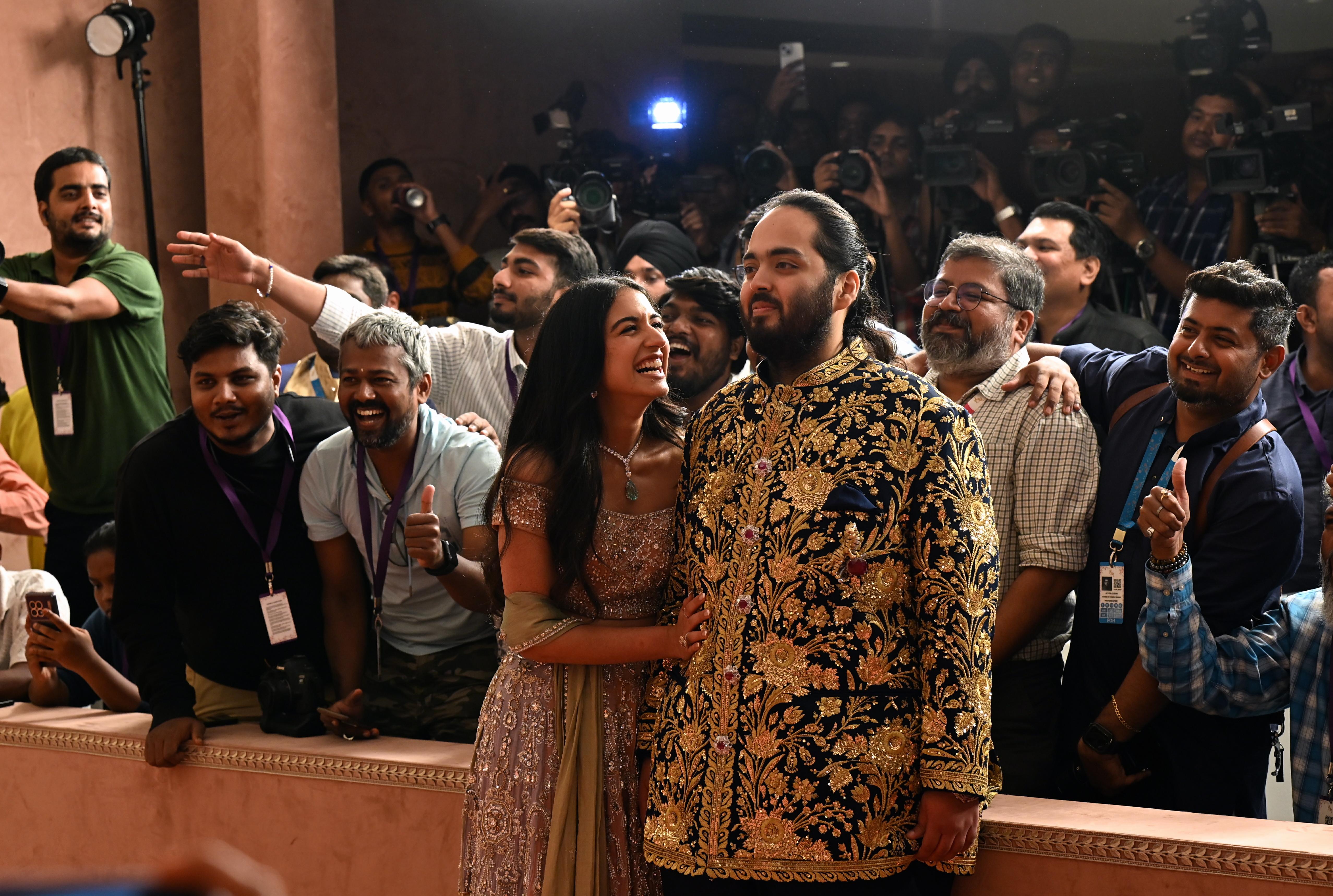 Anant Ambani and Radhika Merchant's grand wedding took place on July 12, attended by several Bollywood celebrities, socialites Kim Kardashian and Khloe Kardashian, and various Indian politicians. This picture is from the couple's sangeet ceremony, where they posed for the paparazzi. Pic/ Satej Shinde