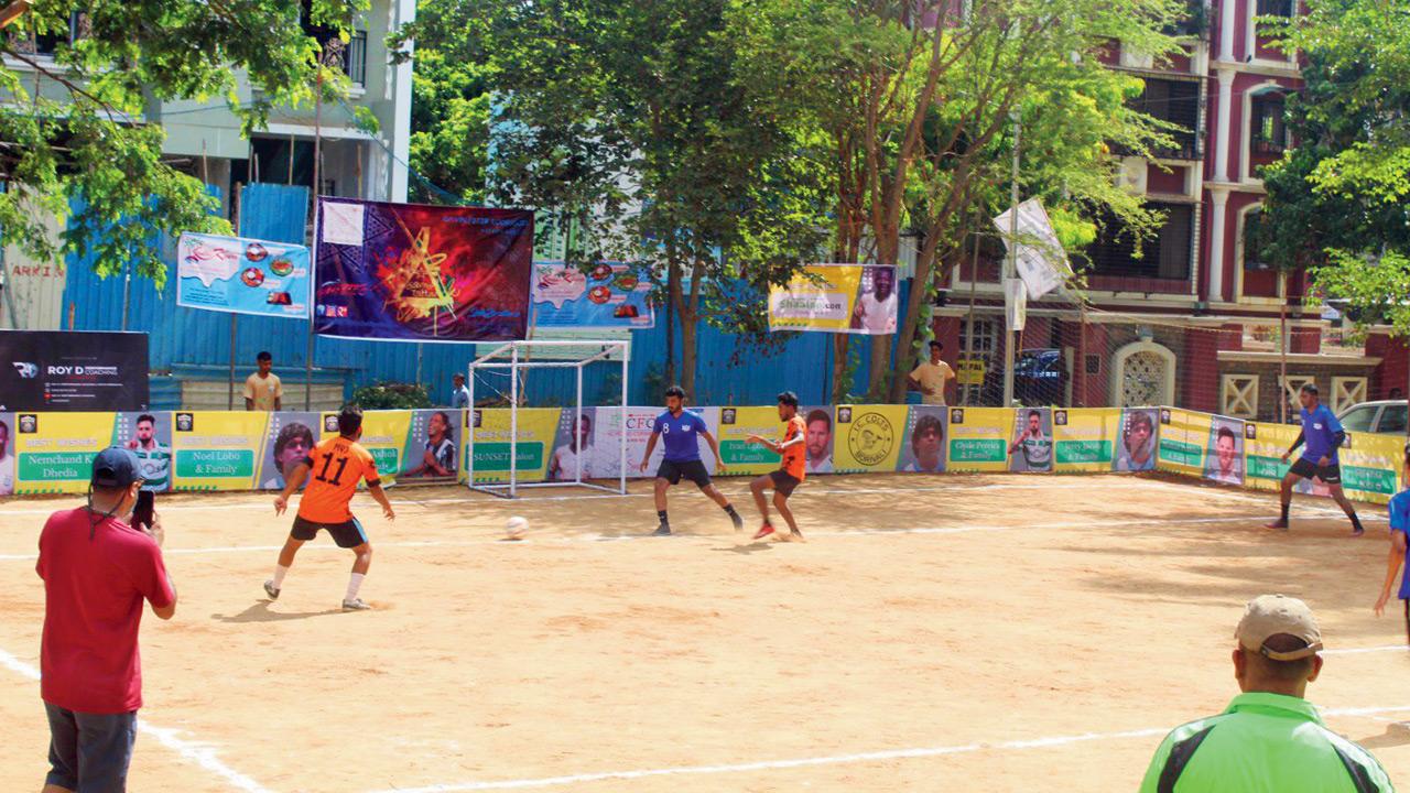 Youngsters enjoy a game of football at the Holy Cross Ground in IC Colony, Borivli