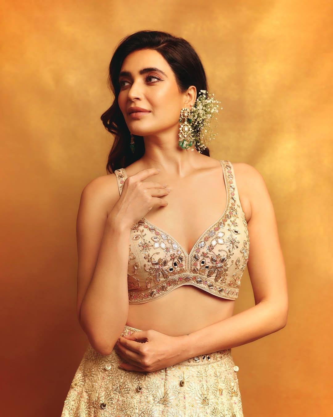 The wedding day is here, and now you have to slay the party like a queen. Your search ends right here! Karishma Tanna's lehenga set is what you need to steal the spotlight