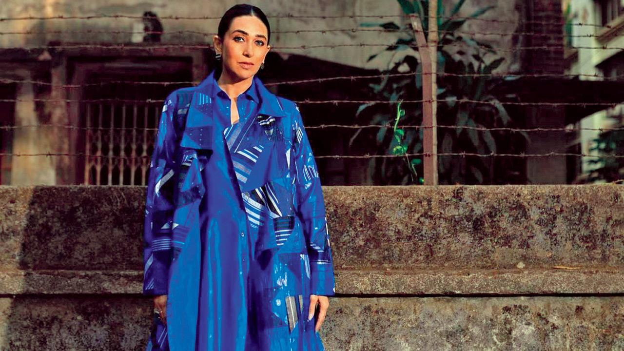 Karisma Kapoor wears a blazer with a dress to complete the look