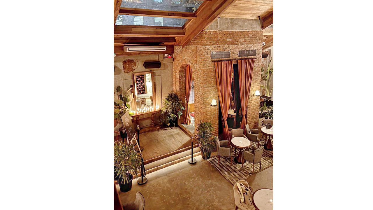 The exposed bricks and furnishings mirror the restored heritage space