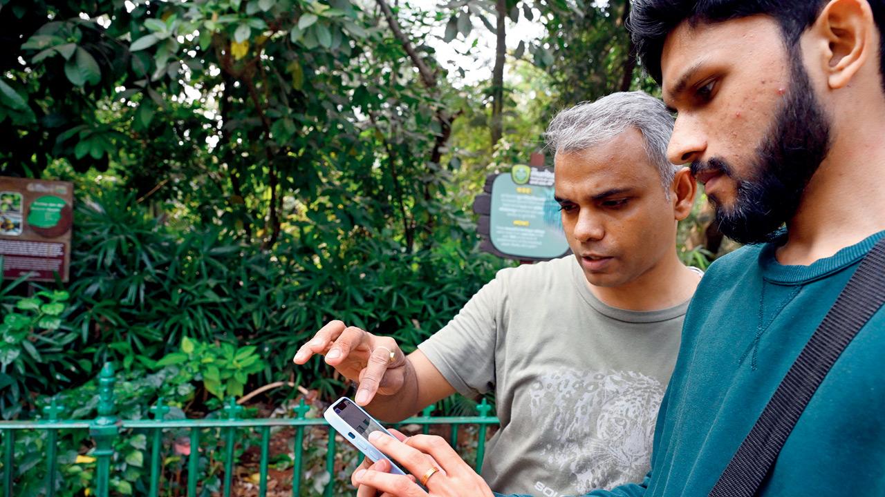 Dr Abhishek Satam (left) explores the app with the writer