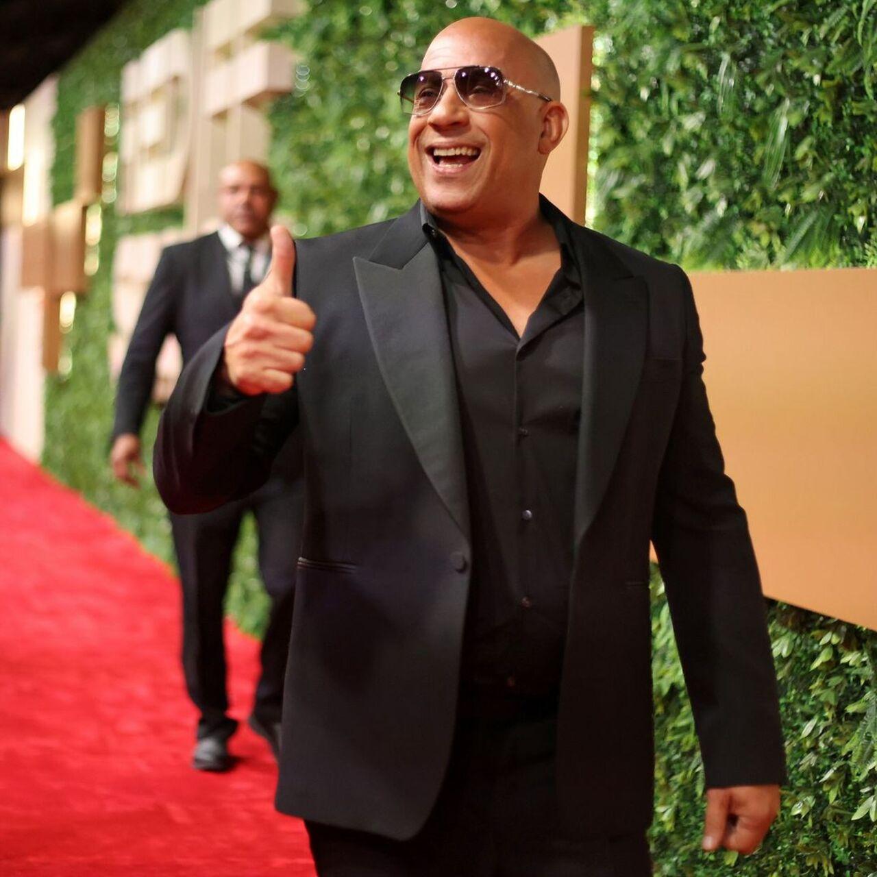 Vin Diesel was all smiles as he arrived for the red carpet in a crisp suit