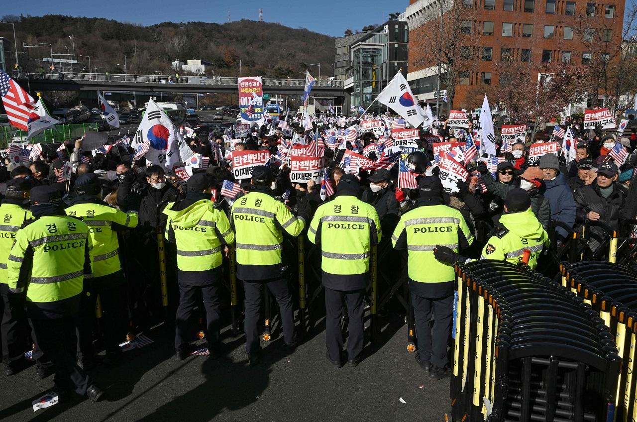 Under South Korean law, the leader of a rebellion can face the death penalty or life imprisonment if convicted. Yoon has presidential immunity from most criminal prosecution, but the privilege does not extend to allegations of rebellion or treason