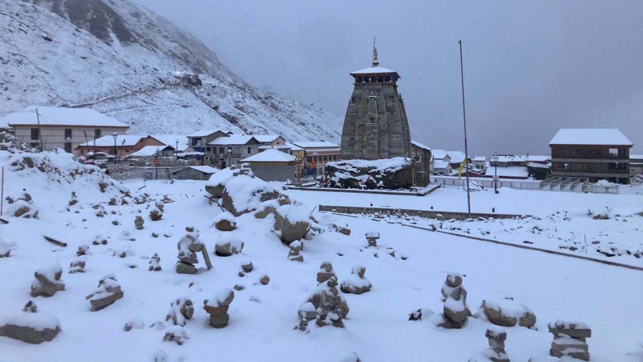 Kedarnath Dham covered with snow after receiving the first snowfall of the season, in Rudraprayag district on Monday