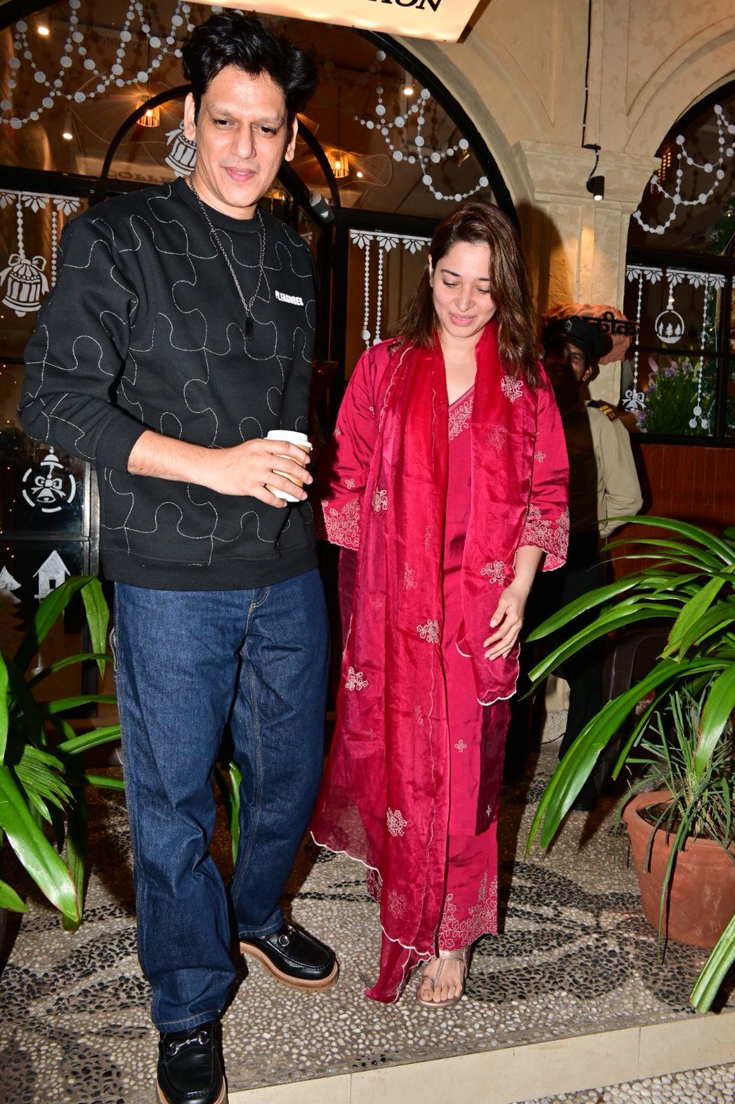 Tamannaah Bhatia and Vijay Varma were snapped as they went out and about in the city. While Tamannaah looked stunning in a red suit with a no-makeup look, Vijay Varma looked stylish in a casual outfit