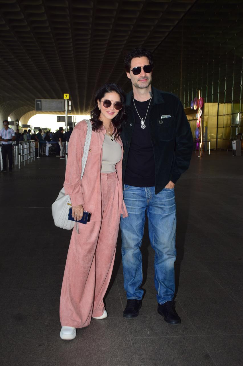 Sunny Leone posed with her husband, Daniel, as they were snapped at Mumbai airport