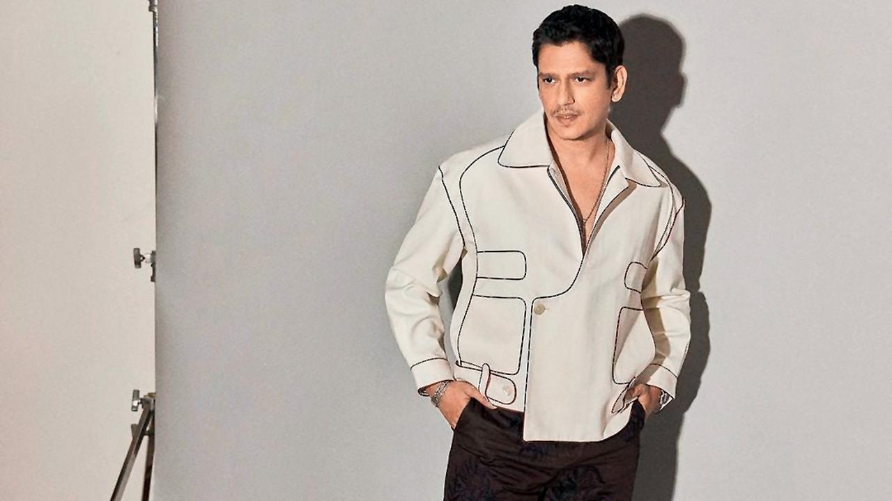 Vijay Varma in maroon high waist hand-embroidered trousers