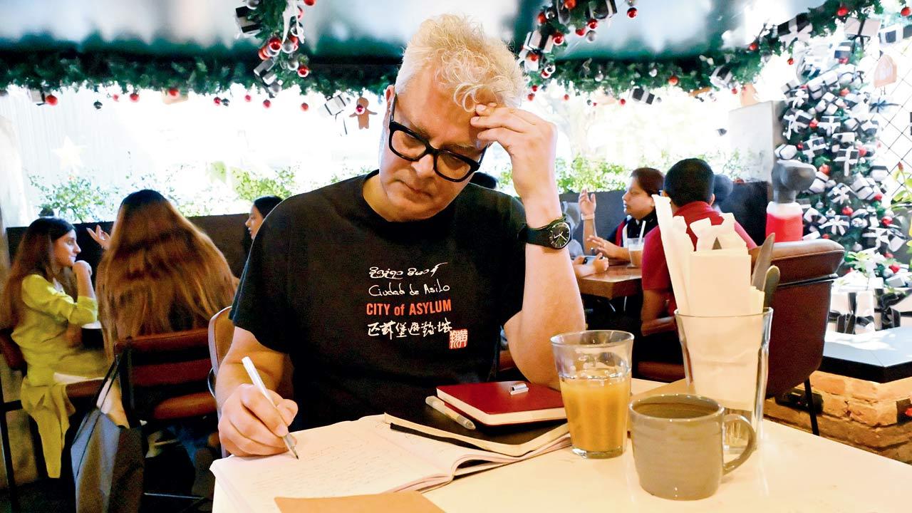 By the time this reporter arrives at the Bandra cafe where we’re meeting Amitava Kumar at 11.30 am on Wednesday, he’s already scribbled about  things he’s seen since stepping out of his AirBnB. Pic/Sayyed Sameer Abedi
